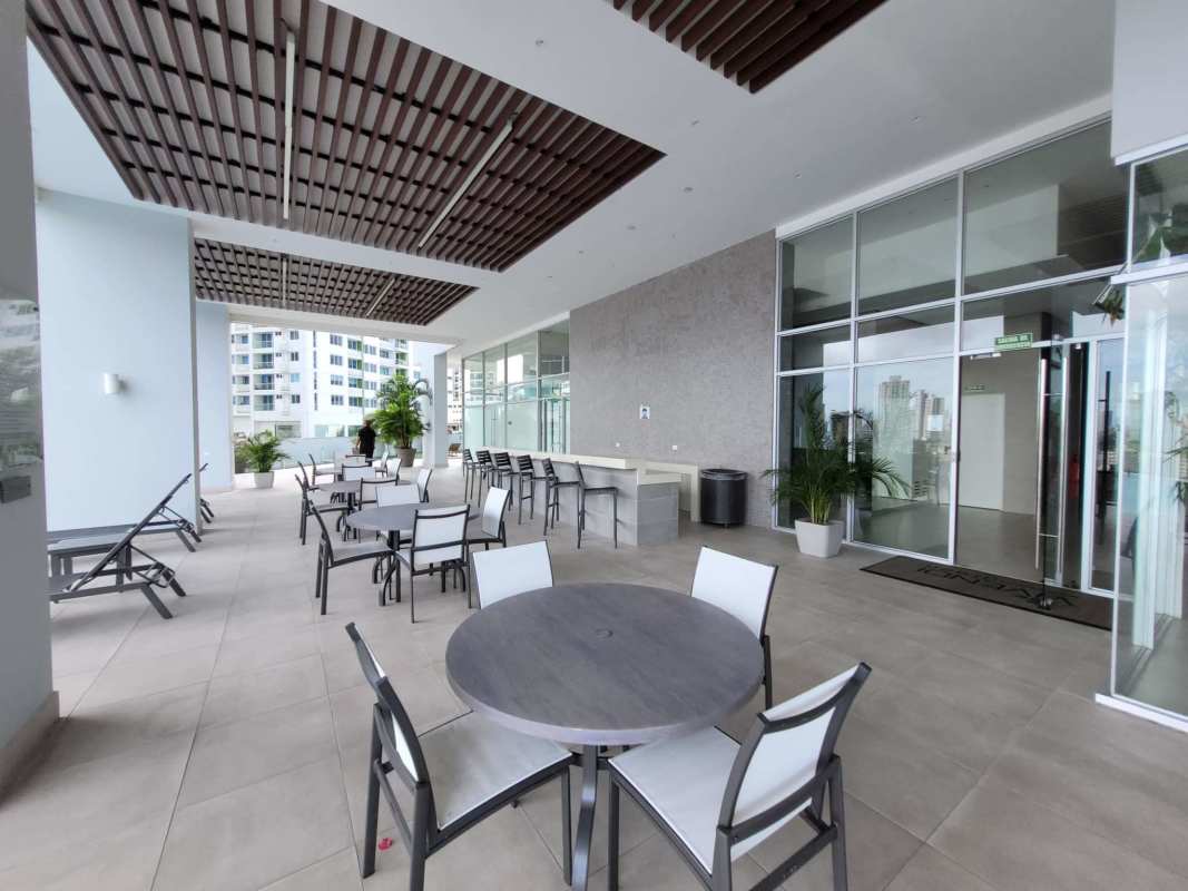 Modern indoor lounge with large windows city views PH Vivendi Green Edison Park Panama City