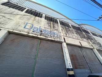 Warehouse interior with windows, open storage, concrete flooring located in Cocosolito Colón Panama