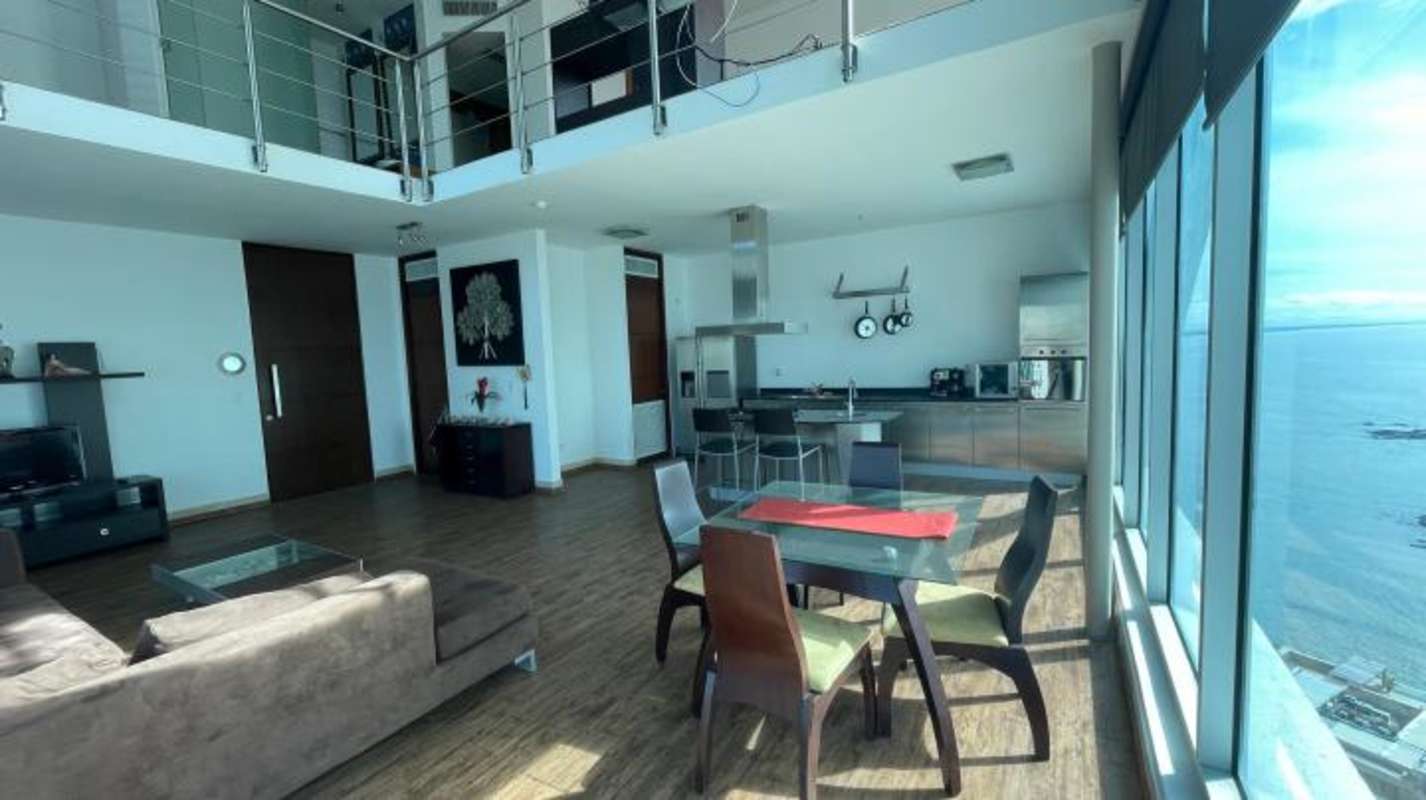 Loft bedroom mezzanine with ocean view windows in PH Loft 41 Punta Pacifica Panama