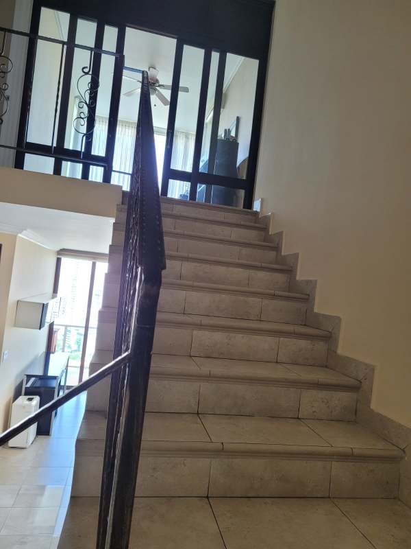 Kitchen with granite countertops and ample cabinetry in Mystic Point penthouse Panama City