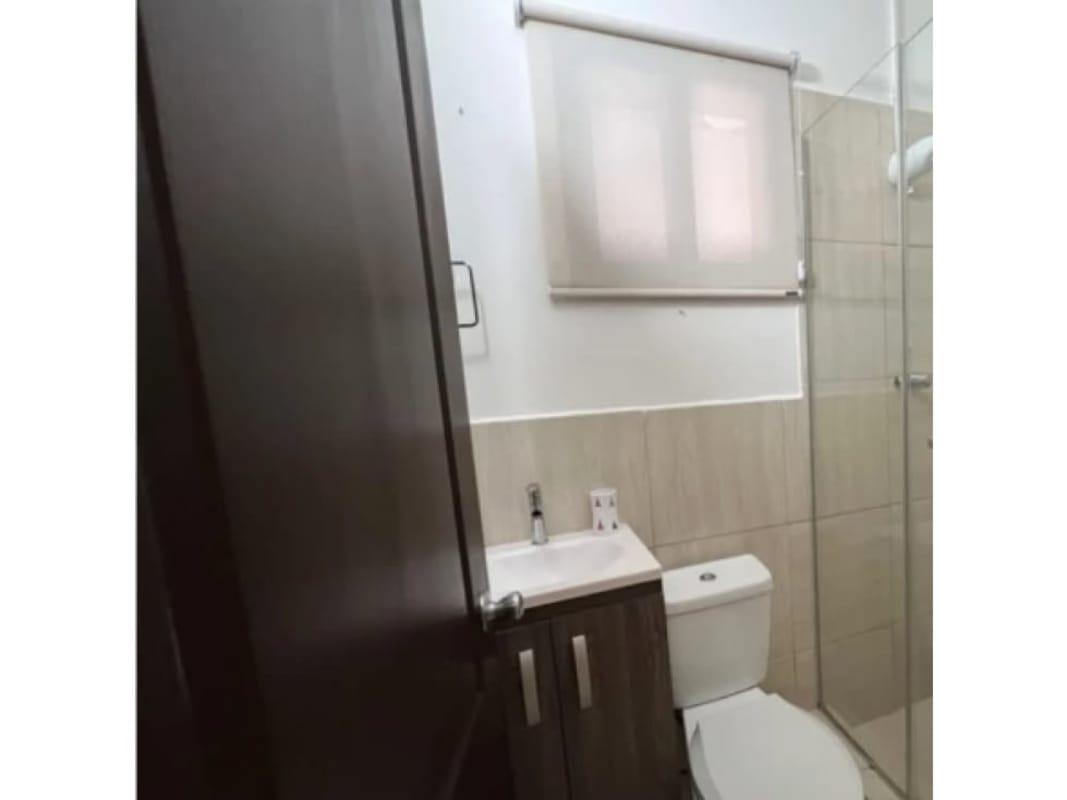 Modern bathroom with glass enclosed shower and vanity PH Versalles I luxury house Panama