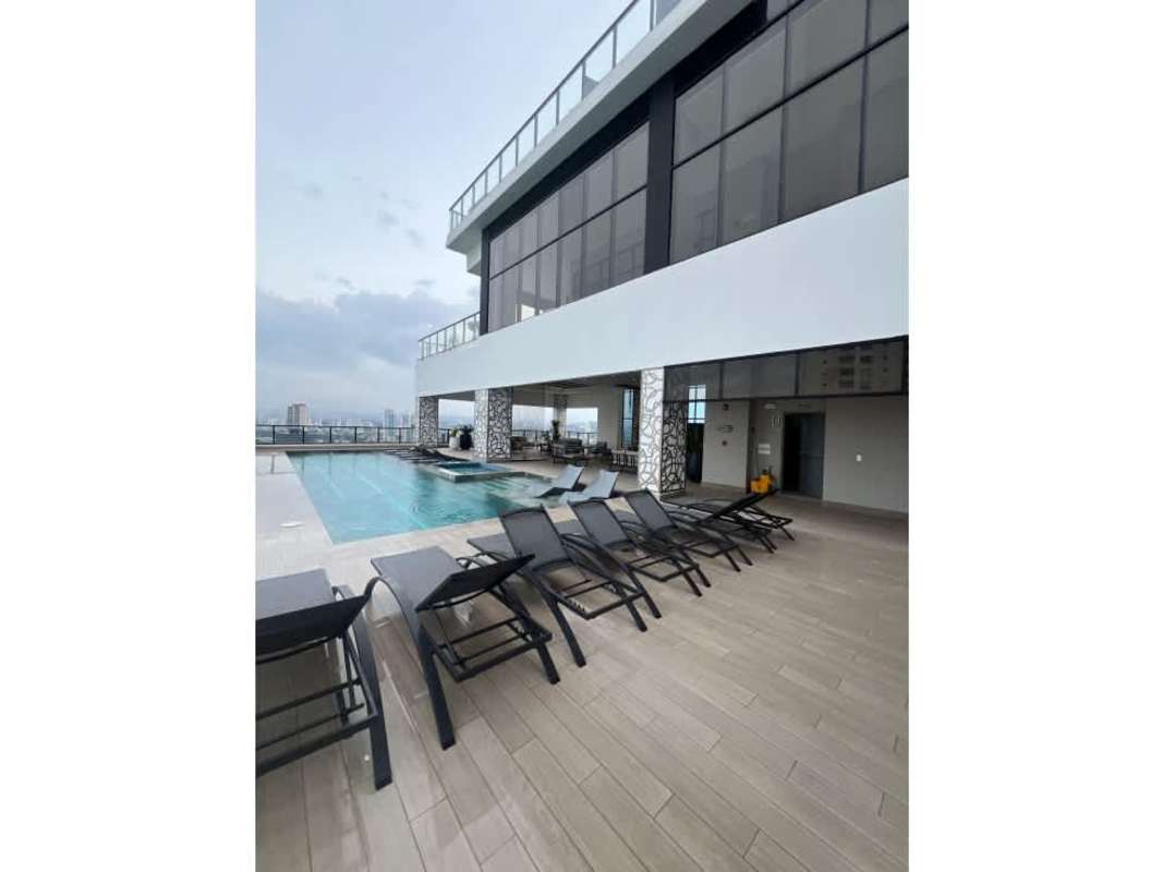 Rooftop pool with ocean and skyline views at PH Arcadia Costa del Este Panama City