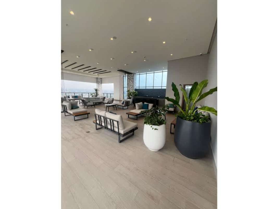 Minimalist living area in apartment with panoramic skyline window PH Arcadia Panama