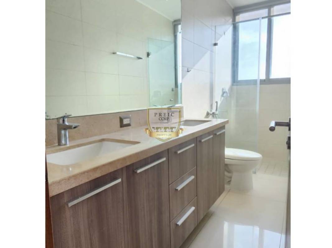 Modern bathroom featuring glass shower large mirror and designer sink within PH Ocean Two Costa del Este Panama
