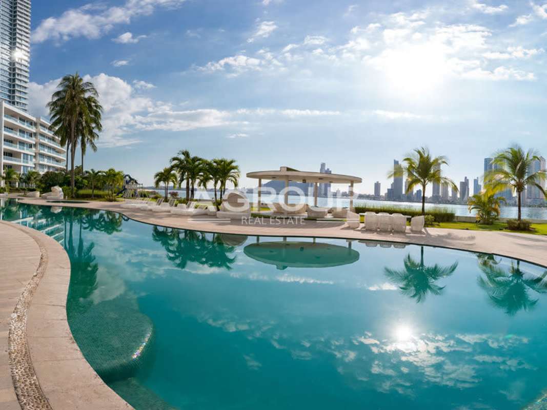 Contemporary high-rise tower with private balconies surrounded by landscaped gardens Panama City