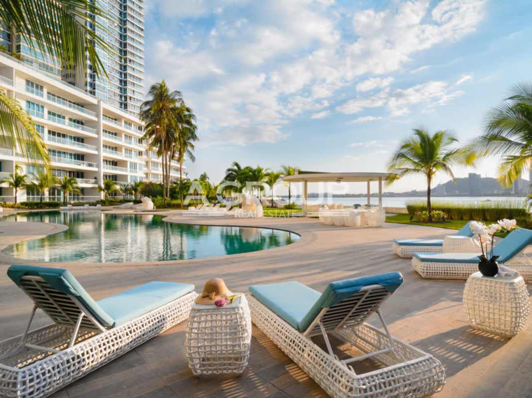 Aerial shot of oceanfront residential tower with landscaped gardens and freeform pool Panama