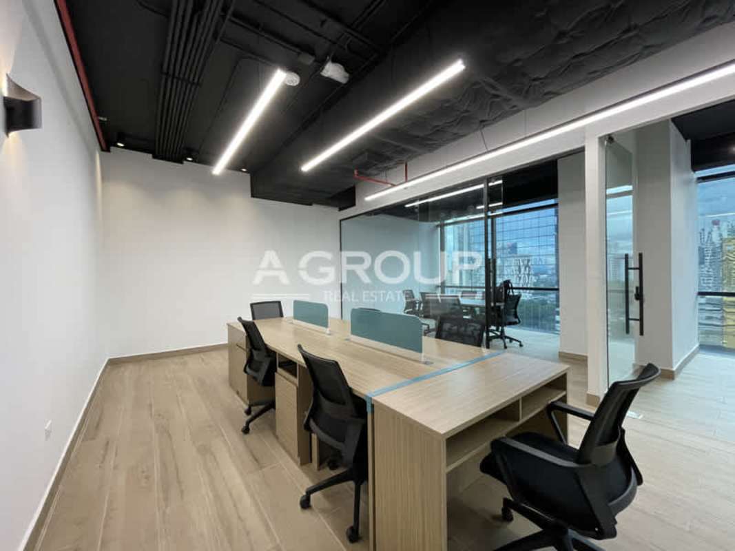 Mid-floor office workspace open plan with large windows in Tower Financial Center Panama City