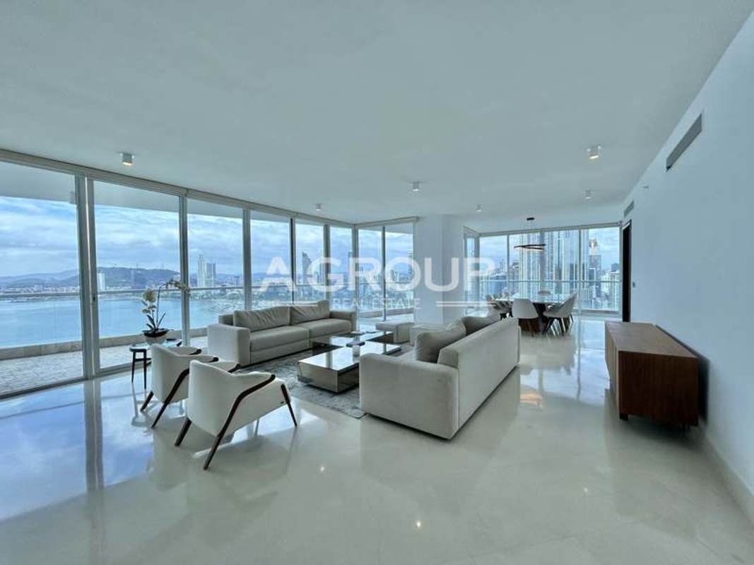 Luxury apartment open-plan living dining with city skyline and ocean views The Point Panama