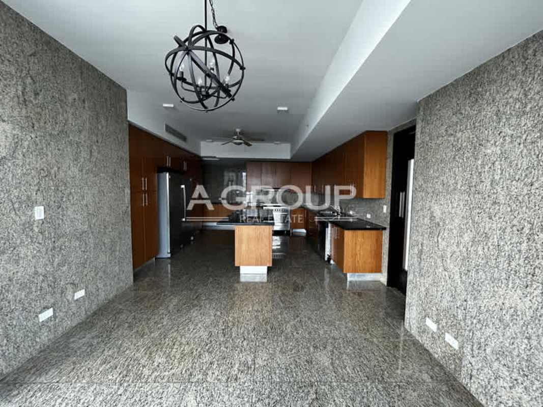 Kitchen with granite floors, wood cabinetry, stainless appliances The Point luxury tower