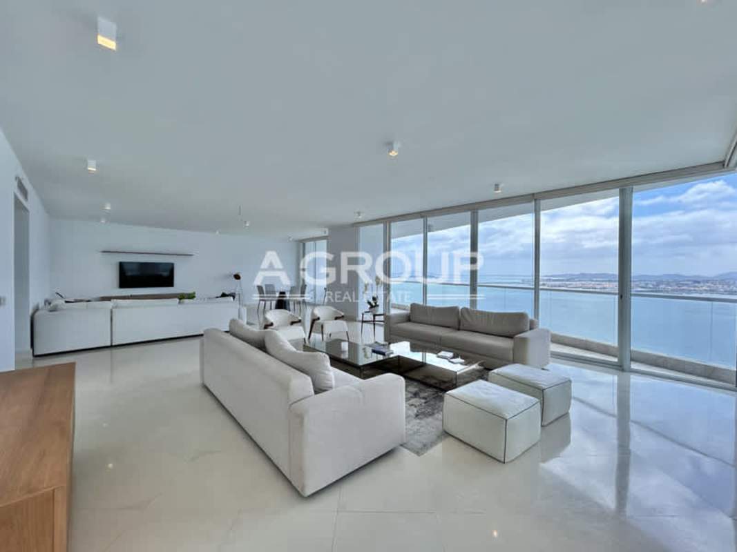 Contemporary living area with ocean view floor-to-ceiling windows luxury condo in The Point Panama