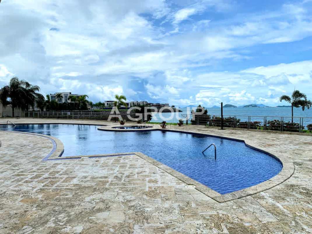 Pool deck at Bahia Pacifica luxury condos with oceanfront infinity pool hot tub and Panama skyline