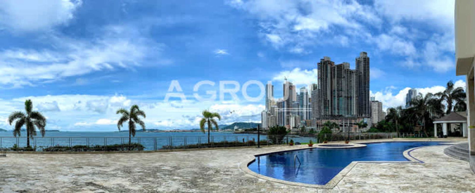 Waterfront outdoor lifestyle at Bahia Pacifica pool area with Pacific Ocean backdrop in Panama City