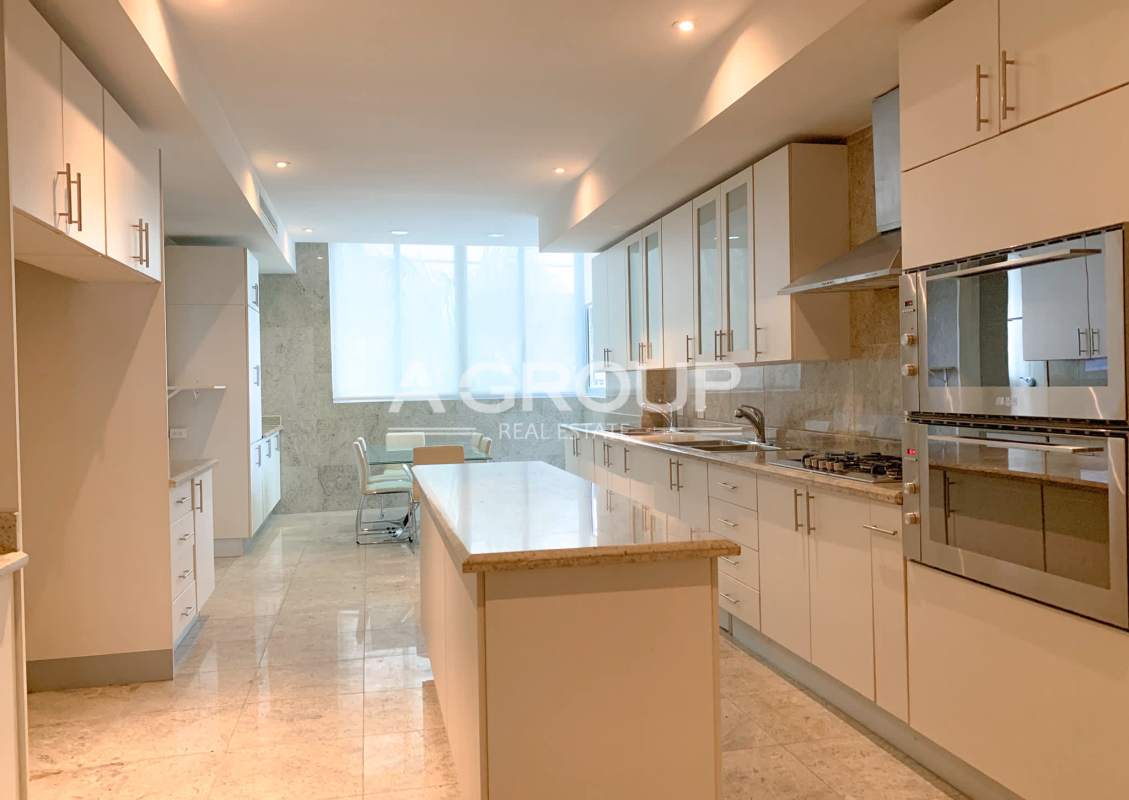 Contemporary kitchen with Italian granite countertops and high-end appliances Miradores The Point Panama City
