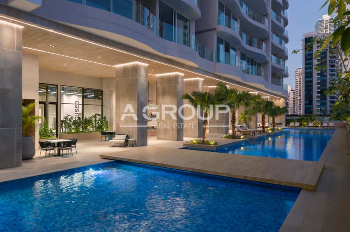 Infinity pool deck with outdoor lounge and ocean view at The Towers Punta Paitilla Panama