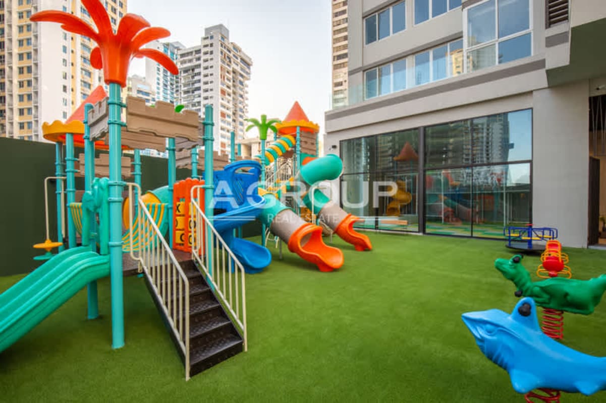 Colorful outdoor children's playground with slides and climbing in luxury apartment The Towers Punta Paitilla Panama