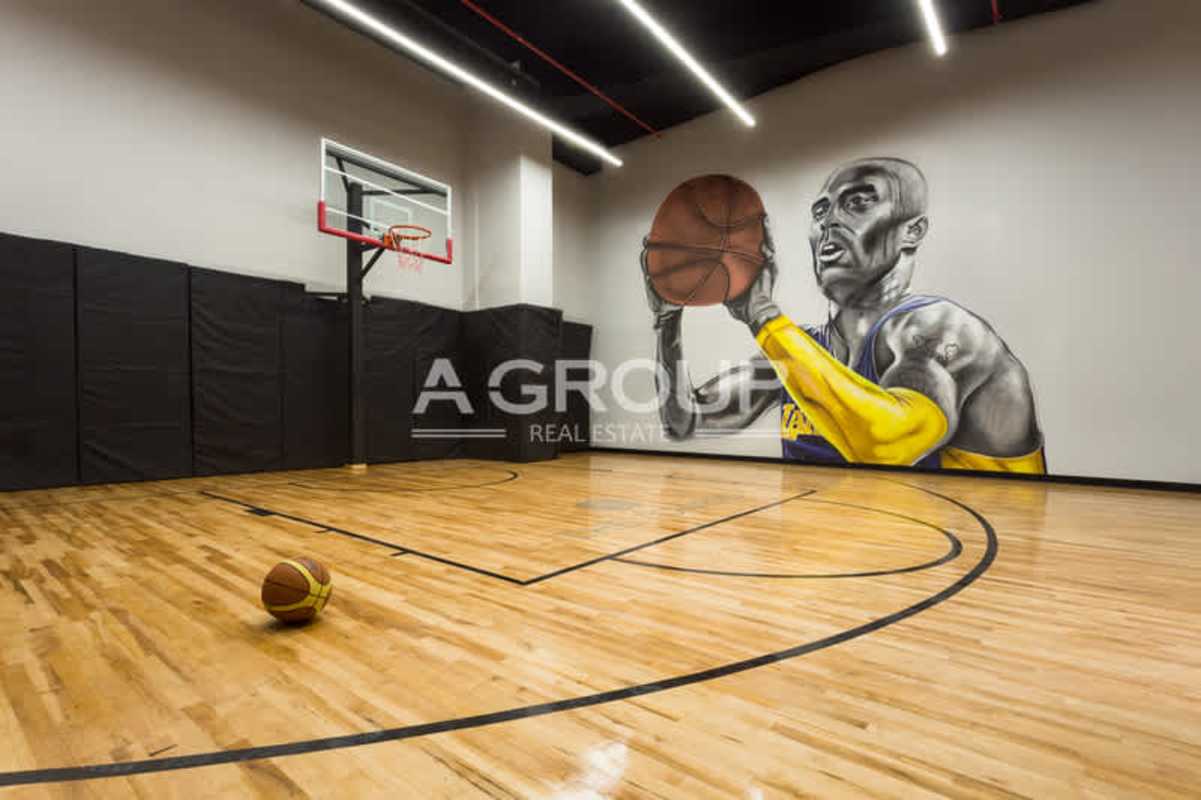 Private indoor basketball court with mural and modern lighting at The Towers Punta Paitilla Panama