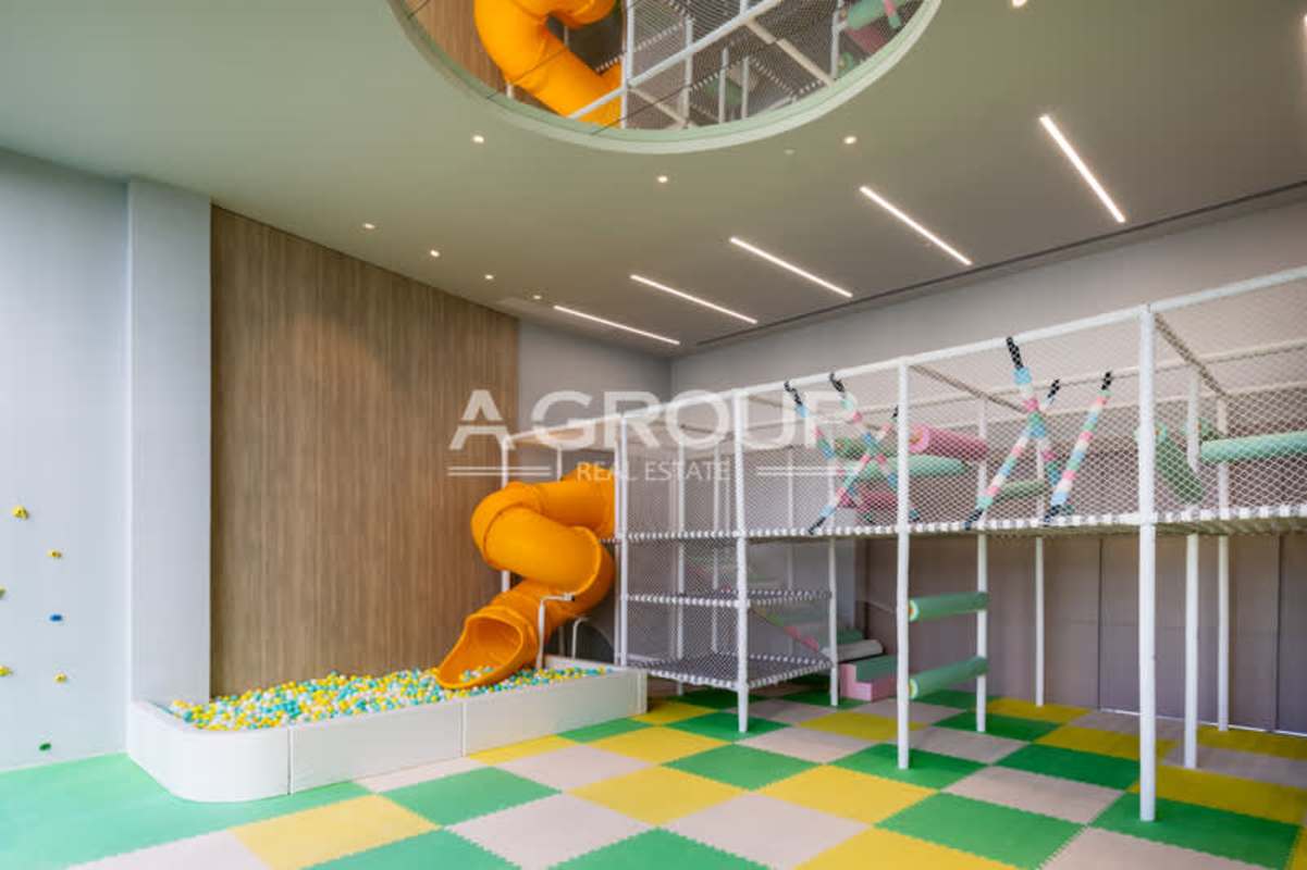 Modern indoor children playroom with slides and ball pit The Towers Punta Paitilla Panama City
