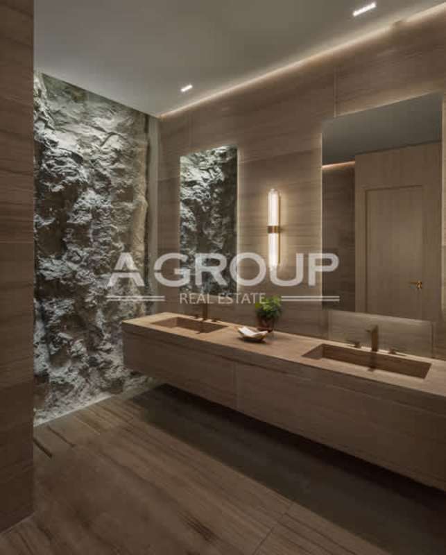 Marble-clad luxury master bathroom with double vanity and modern fixtures in The Towers Punta Paitilla