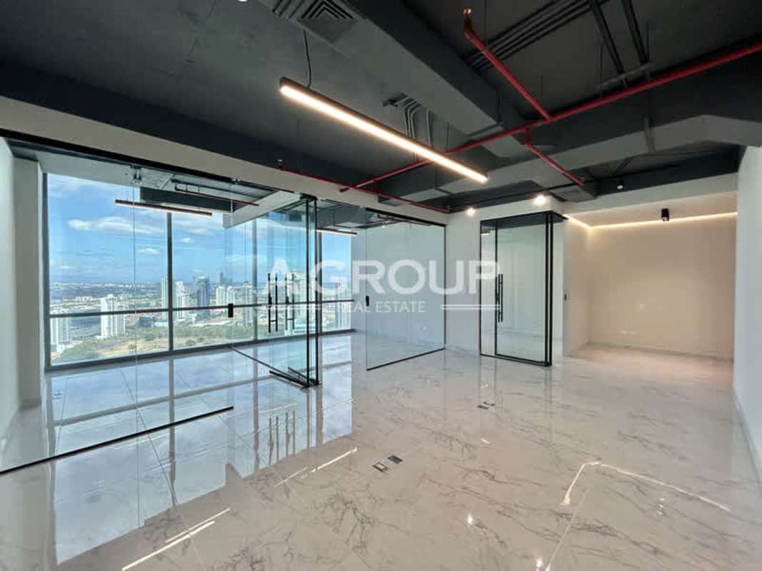 City view office with floor-to-ceiling windows marble tile exposed ceiling Financial Park Panama