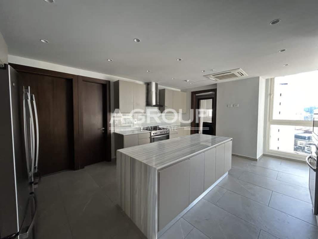 Luxury marble bathroom with glass-enclosed shower and double vanity in The Towers Punta Paitilla Panama