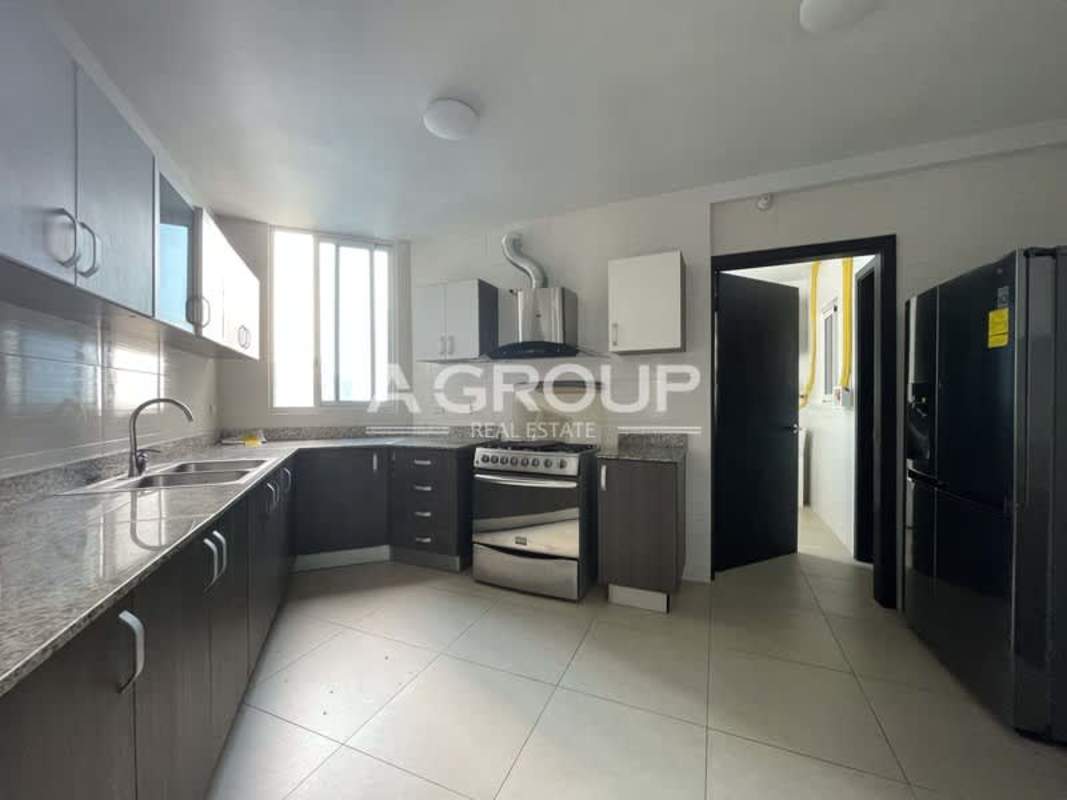 Modern kitchen with granite countertops and appliances in PH Country Club Costa del Este Panama