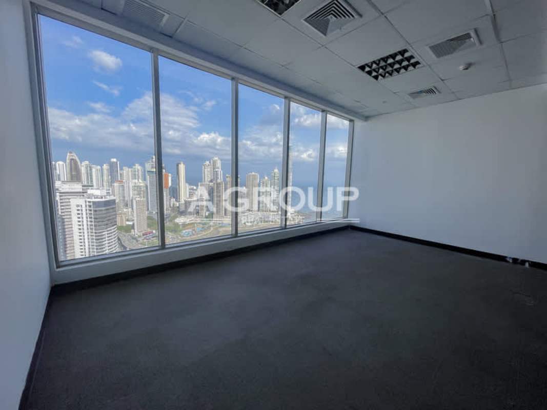 Office interior large glass windows panoramic Panama City skyline PH BICSA