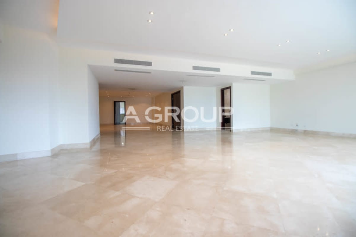 Expansive living room with marble floors, terrace access and ocean views at Miradores at The Point Punta Paitilla Panama City