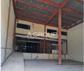 Loading dock with industrial roll-up doors and parking at warehouse in Zona Libre Colon Panama