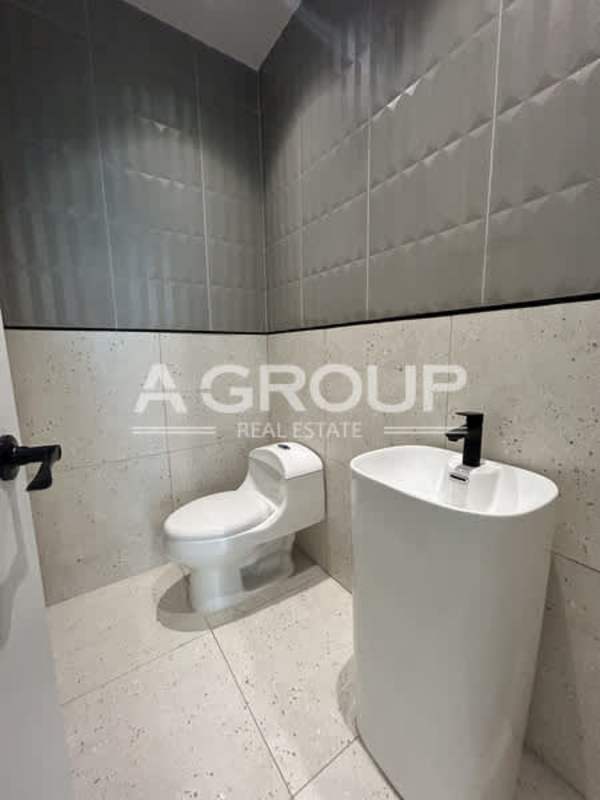 Contemporary bathroom with pedestal sink and tile in Financial Park Costa del Este office