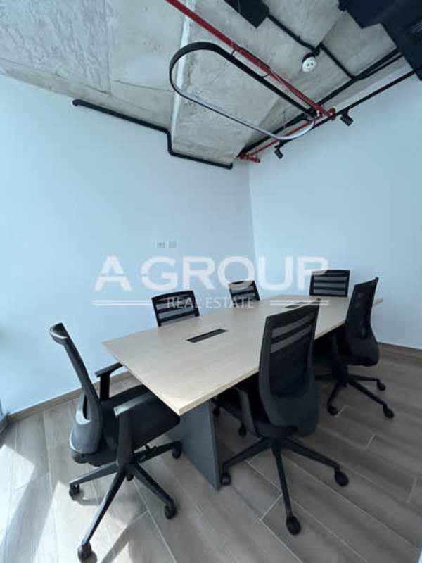 Private enclosed office area wood look floor and industrial ceiling Financial Park Costa del Este Panama