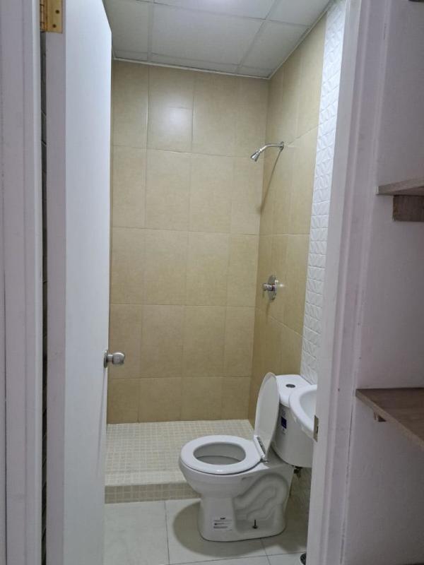 Small bathroom beige tiles walk-in shower Residences San Cristobal Panama