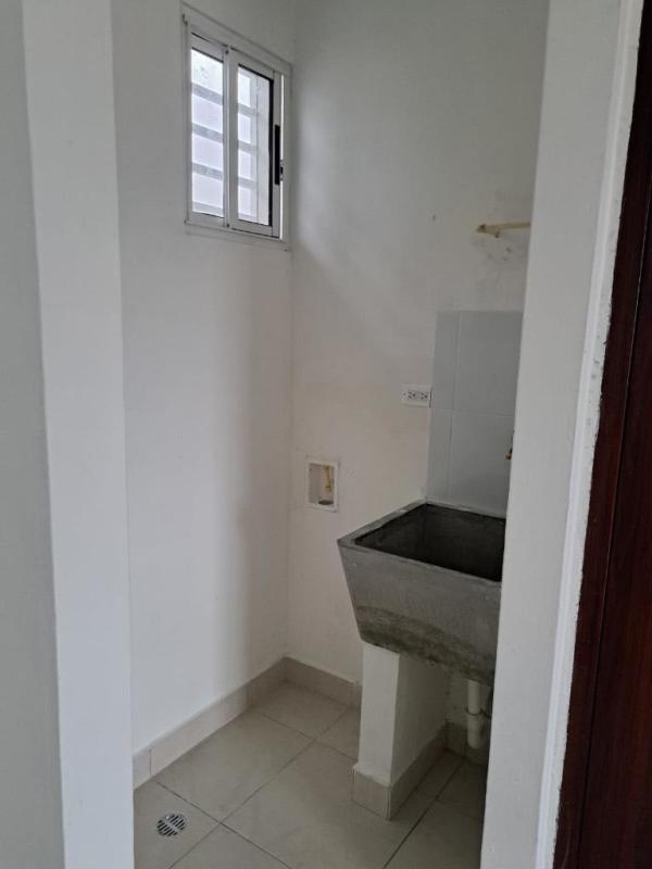 Dedicated laundry with utility sink tiled floor Residences San Cristobal Panama