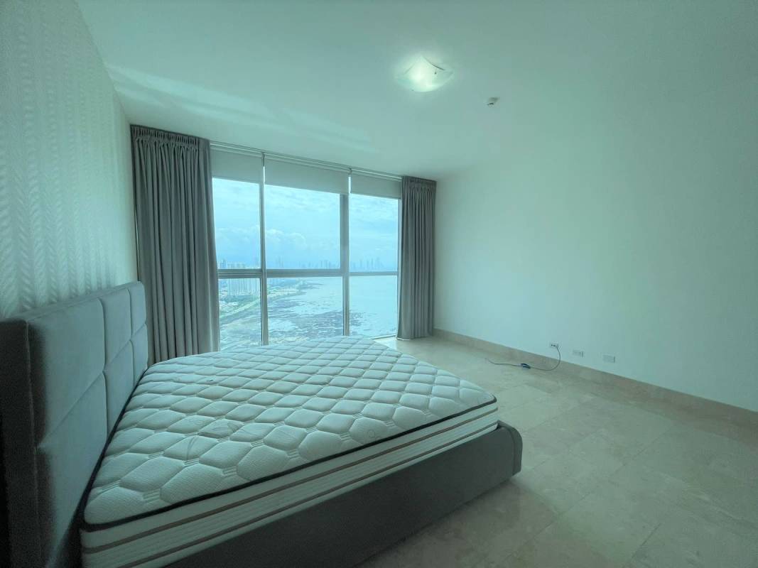 Modern bathroom with glass shower beige tiles vanity Grand Tower Punta Pacifica Panama