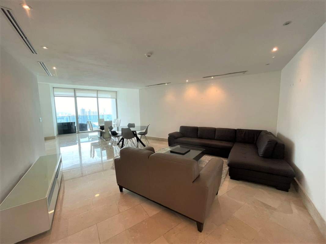 Modern living dining space with ocean balcony floor to ceiling windows Grand Tower Punta Pacifica Panama Panoramic views