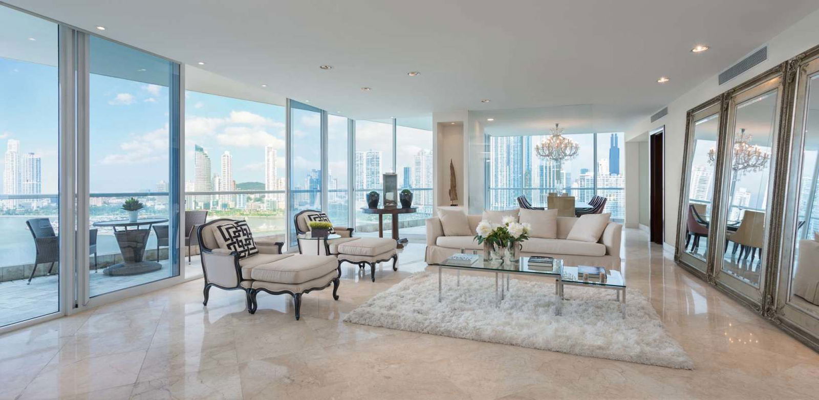 Spacious open living and dining with oceanfront windows at The Point Tower for rent