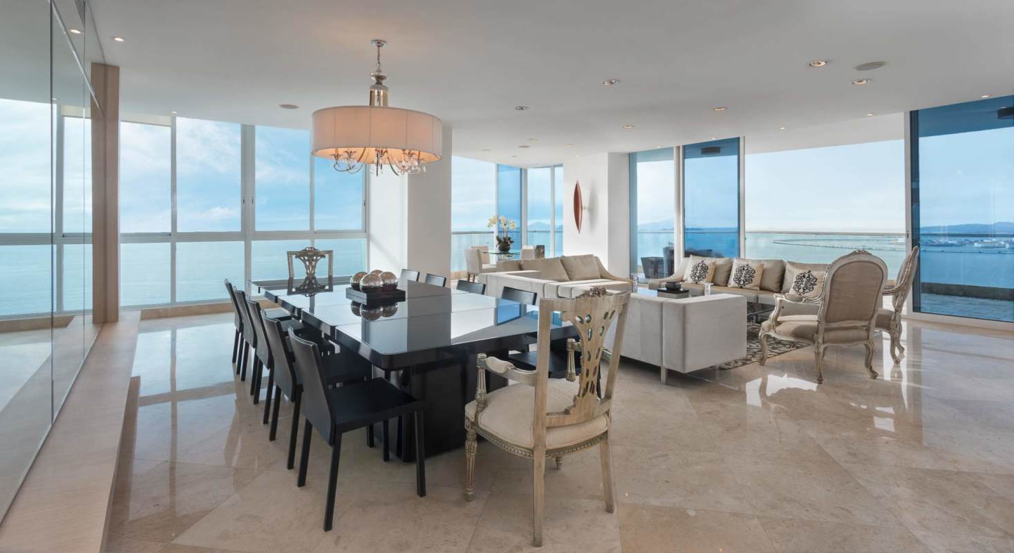 Open-concept luxury furnished living space with sea views at The Point Tower for rent