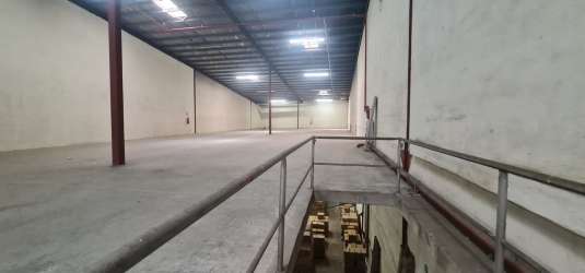 Small office area with desks and computers inside commercial warehouse Colón Panama