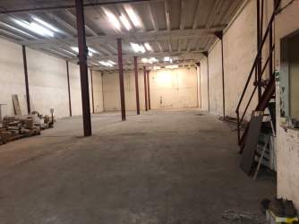 Ramp and shelving inside large industrial warehouse in Zona Libre Colon Panama