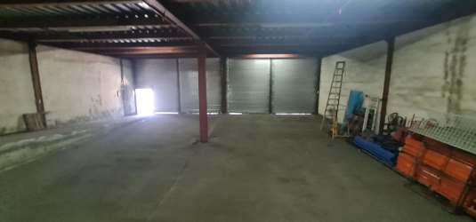 Large empty warehouse interior with concrete floor and high ceilings Colón Panama
