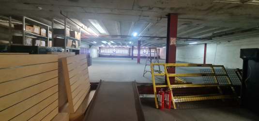 Large empty warehouse interior with exposed beams and concrete floor in Zona Libre Colon Panama