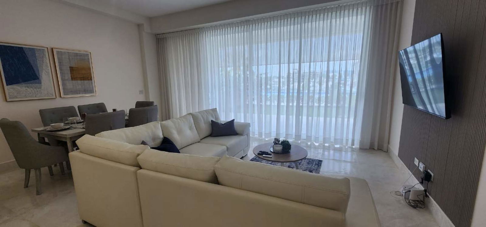 Open plan living dining with large windows at Beach Club Residences Ocean Reef