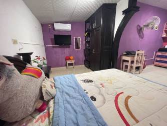 Bedroom with air conditioner, closet, tiled floor in Los Algarrobos David Panama