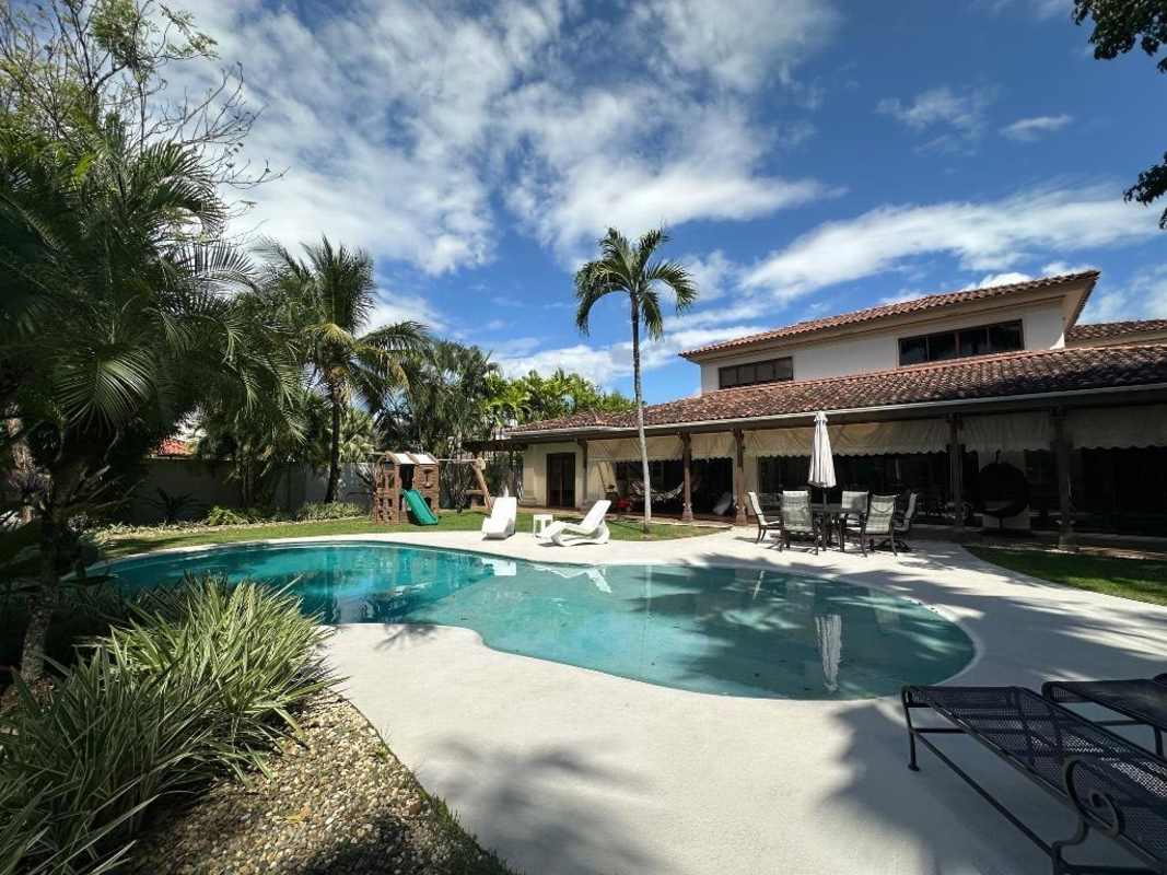 Elegant dining room with chandelier and detailed ceiling in luxury residence Costa del Este Panama
