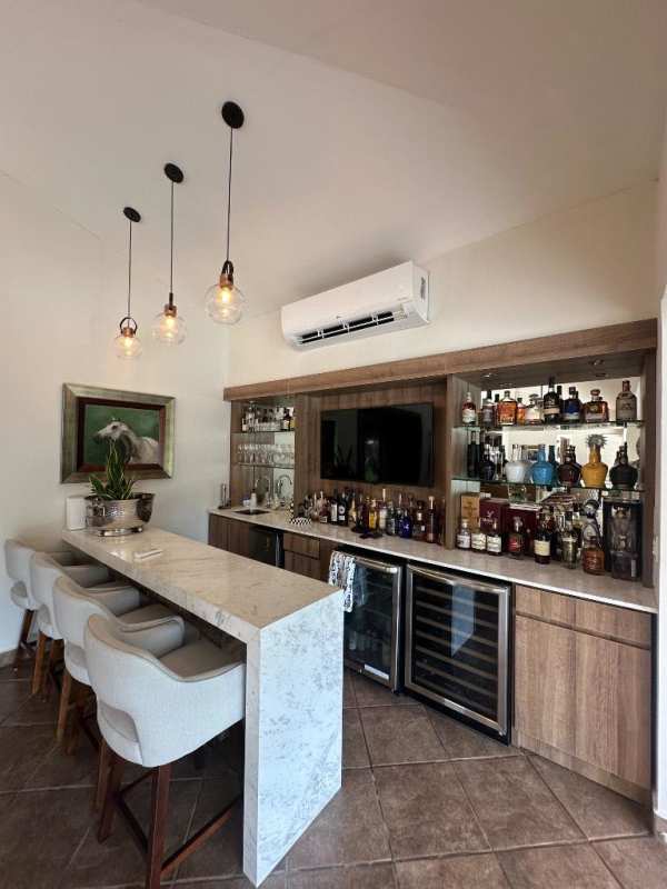 Modern luxury kitchen with granite countertops and island in Balmoral Costa del Este home for sale