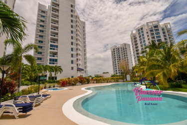 Bright spacious living and dining area with balcony access ocean views in The Founders Playa Blanca Penthouse Panama