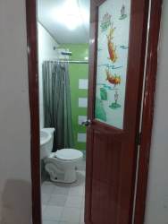 Simple narrow hallway with white walls and tiled floor La Chorrera Panama