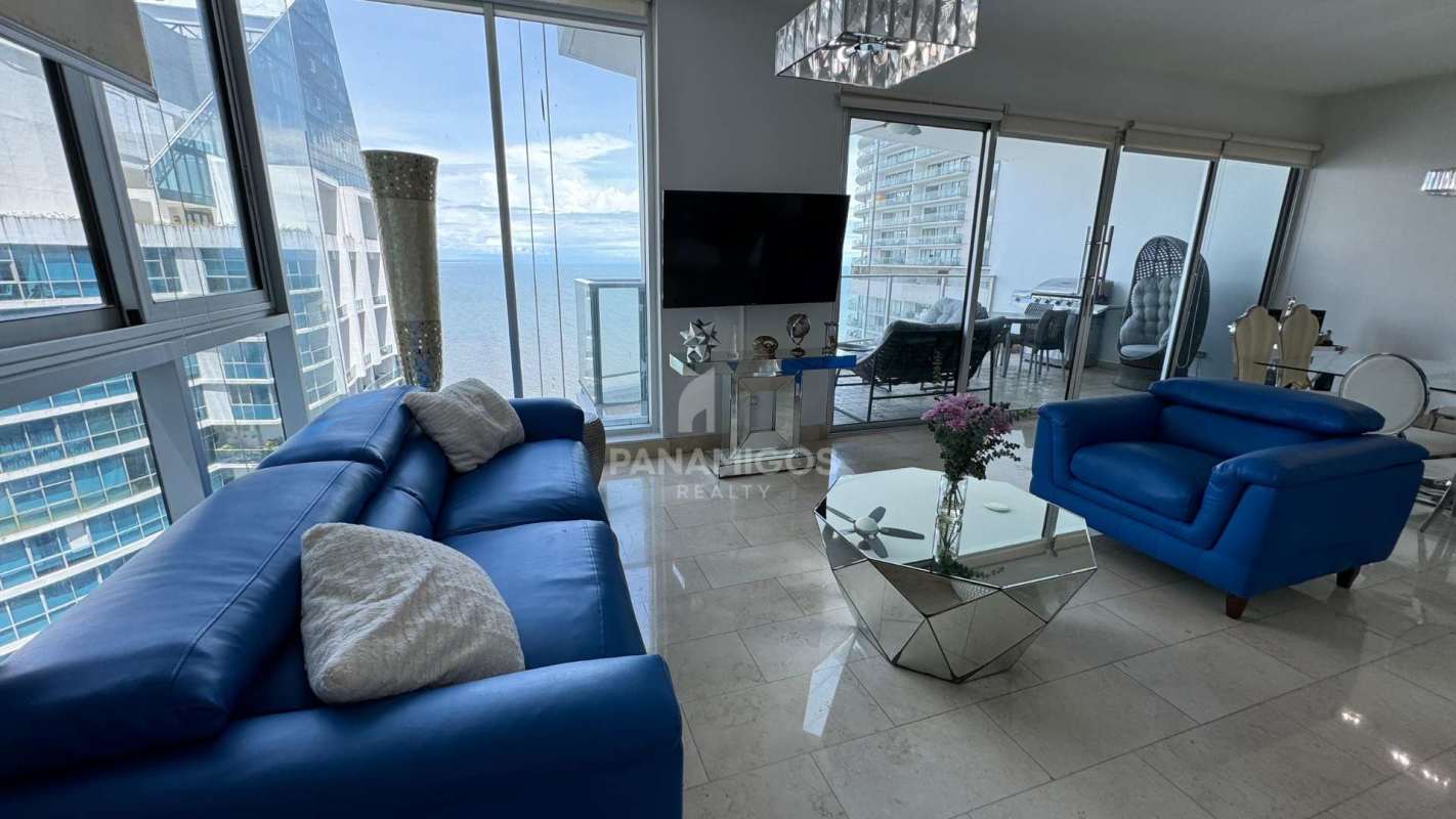 Bright guest bedroom featuring large windows and Pacific views in luxury Punta Pacífica condo