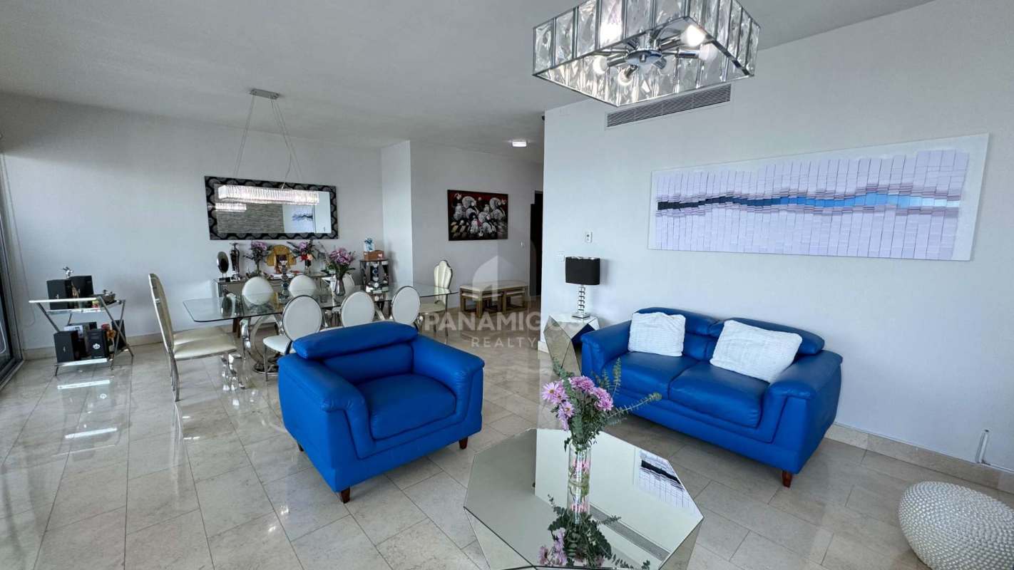 Contemporary dining space with large windows offering ocean vistas at Pacific Village