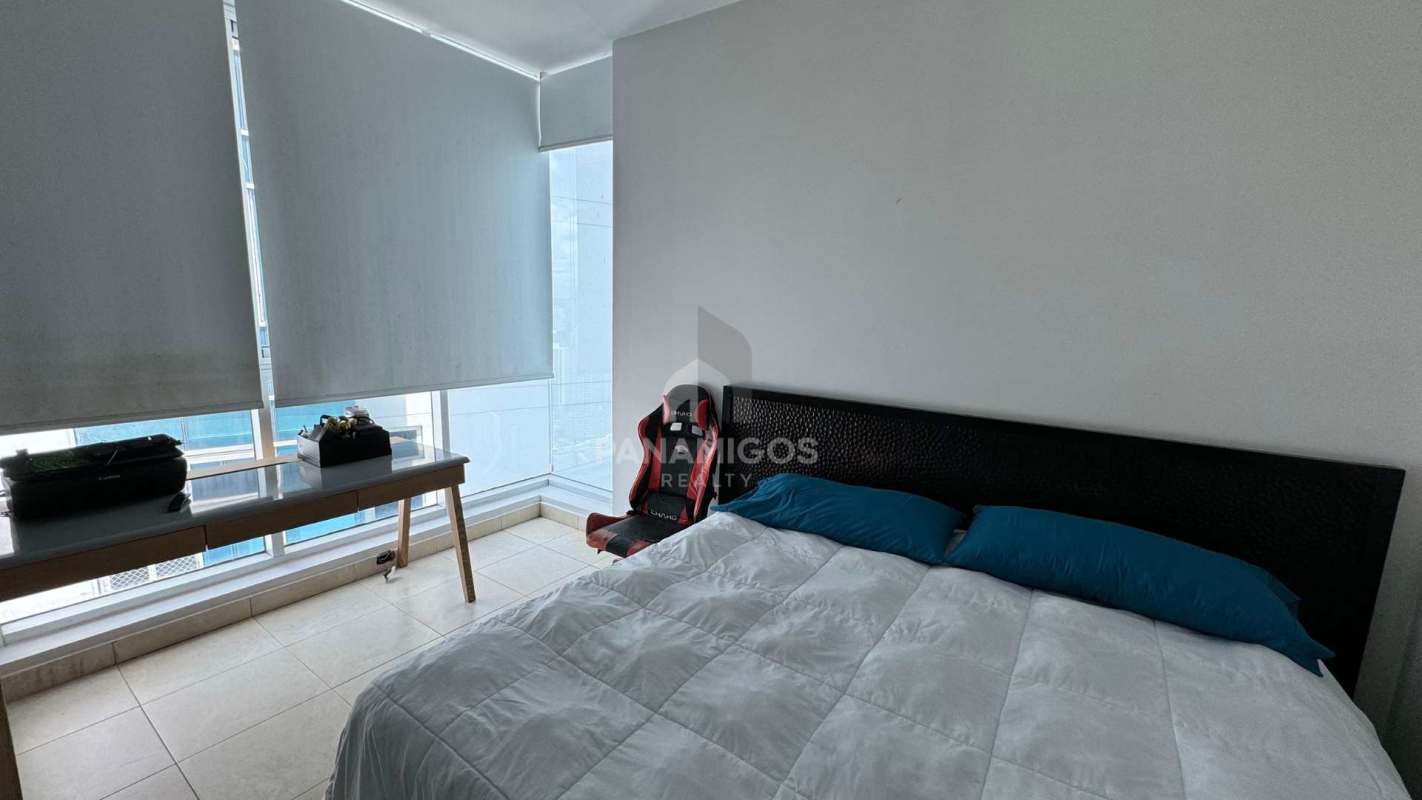 Stylish kitchen with granite countertops and stainless steel appliances in Pacific Village Punta Pacífica