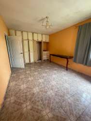 Ample bedroom with tile floor, closet, bright walls in Alto Boquete house
